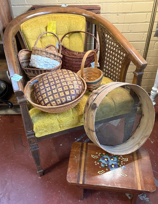 Vintage chair with gold velvet cushion, assorted woven baskets, stream sifter, and a hand-painted floral wooden stool—ideal for rustic or farmhouse décor lovers