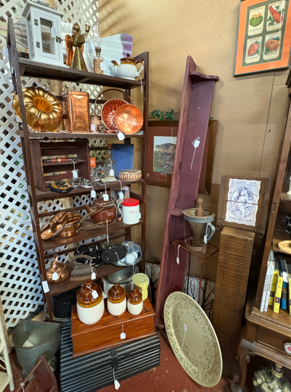 Antique and vintage kitchenware collection featuring copper molds, crocks, teapots, and farmhouse décor. Perfect for rustic kitchen styling, collectors, and farmhouse-inspired home design