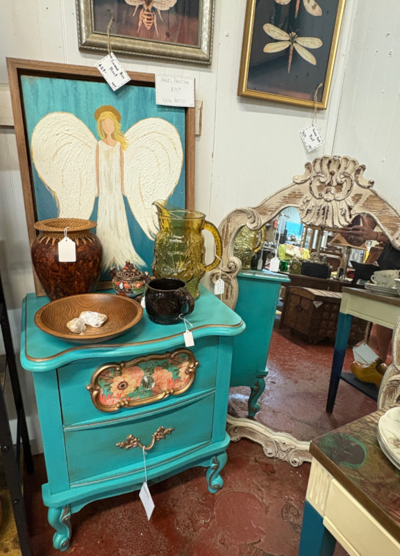 Charming vintage turquoise nightstand with floral details, paired with rustic décor, amber glassware, and local artist angel painting. Perfect for shabby chic, cottage core, and farmhouse-style interiors.